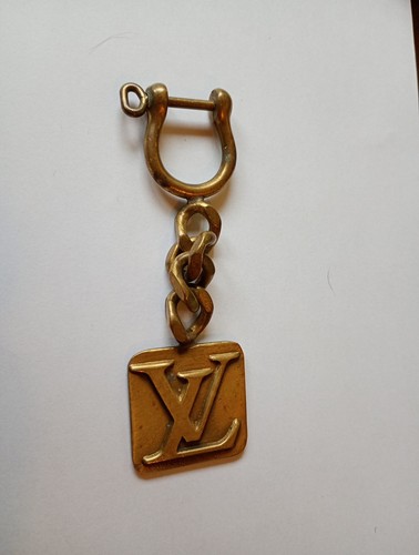 Louis vuitton charm ottone - louis, ,
